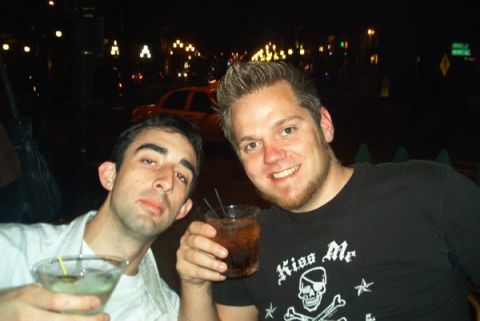 2004 Yamaha XL700 3-Pass - Two men enjoy drinks at night, with a yellow car barely visible in the blurred background.