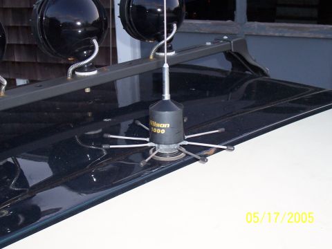 1994 Ford Bronco - A Wilson 1000 antenna is mounted on a roof rack with spotlights, suggesting a vehicle equipped for communication or specialized use.