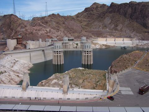 2002 Ford GT - Hoover Dam scene with water, mountains, and a few vehicles visible.