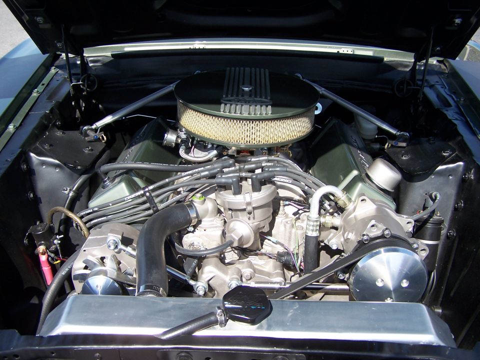 Engine bay with V8 engine, air filter, and radiator