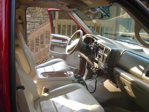 2002 Ford Excursion - Interior view of a 2002 Ford Excursion, highlighting the tan leather seats and dashboard details.