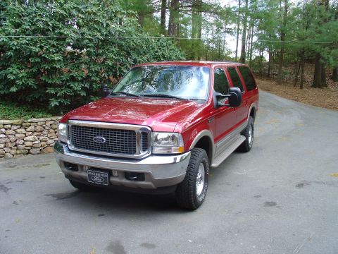 2002 Ford Excursion - This 2002 Ford Excursion is shown in a three-quarter front view, parked on a paved driveway.