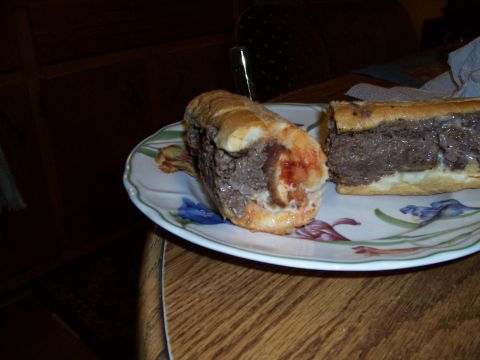 1995 Ford Bronco - Two steak sandwiches are served on a decorative plate, with a Supermotors.net watermark visible in the lower right corner.