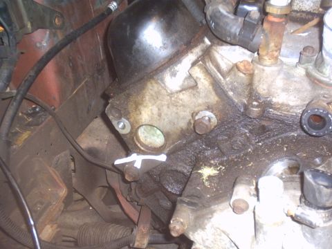 1986 Ford Mustang - Engine block detail with visible hoses and fasteners, likely from a vehicle repair.