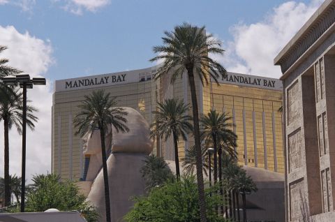 1994 Ford Bronco - The iconic Mandalay Bay resort in Las Vegas is visible behind palm trees and a large Sphinx statue.