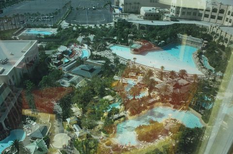 1994 Ford Bronco - Aerial view of a resort complex several swimming pools, water slides, and a large parking area.