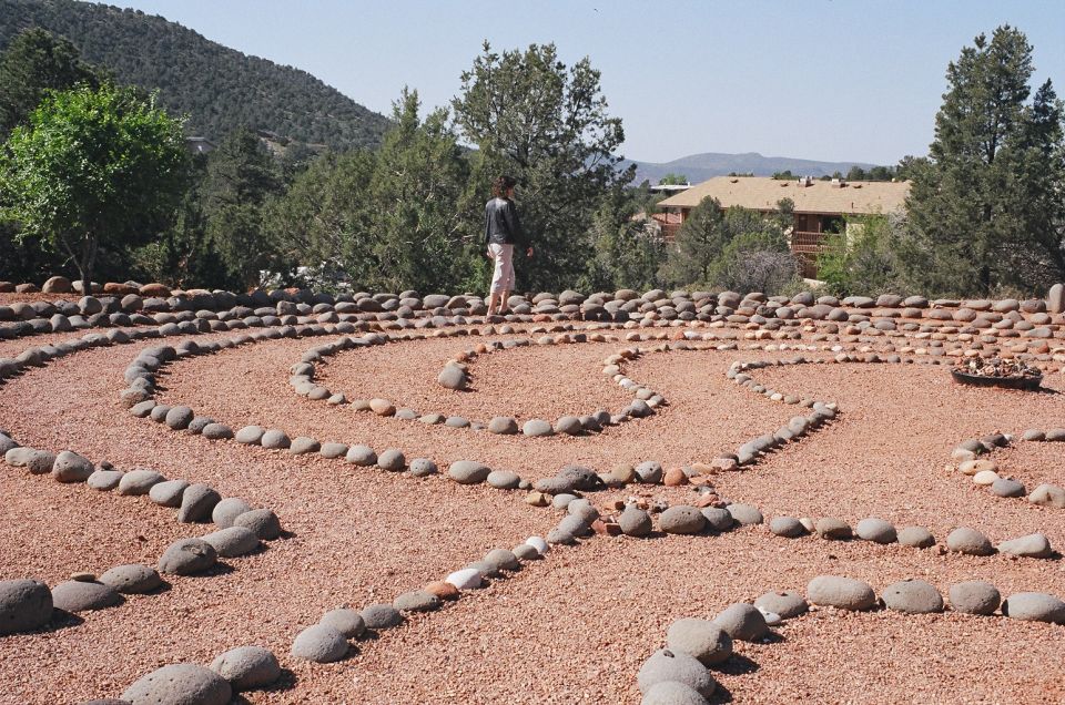 Person in stone labyrinth with Supermotors.net logo