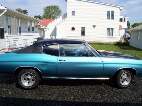 1971 Chevrolet Chevelle - This coupe features a two-tone paint scheme with a black vinyl roof and hood accent.