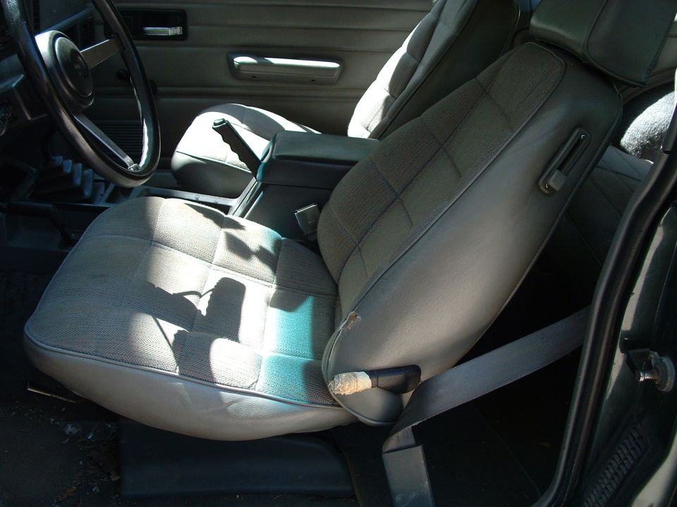 Interior of a Jeep Cherokee showing front seats, dashboard, and center console