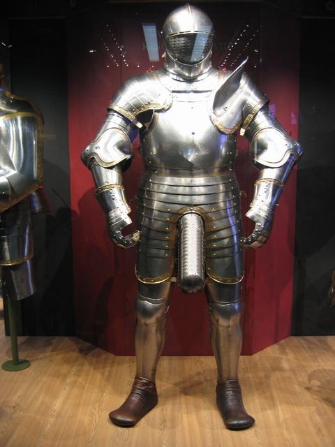 1983 Ford Bronco - A full suit of ornate metal armor stands on display in a museum setting.