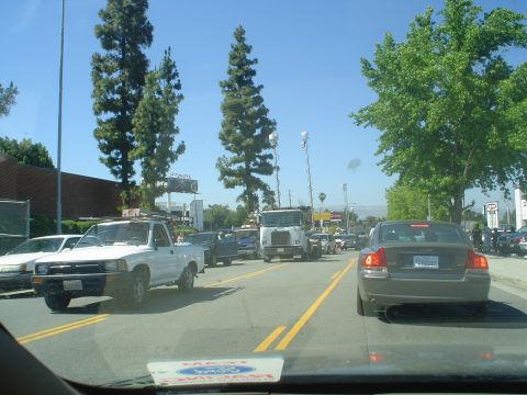 1993 Ford Taurus - View from inside a car shows a traffic jam with a white pickup truck and other vehicles on a sunny day.