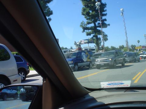 1993 Ford Taurus - A blue news van with "CBS 2 NEWS" branding is seen in traffic on a sunny day.