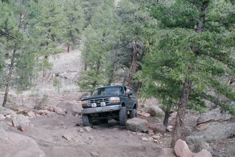 1996 Ford Bronco - Kept climbing up rock on Drivers side and sliding off...