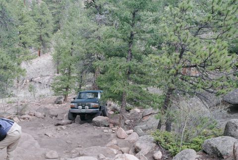 1996 Ford Bronco - Trying to work my way between both rocks. Ended up catching my passenger side rocker panel pretty good.