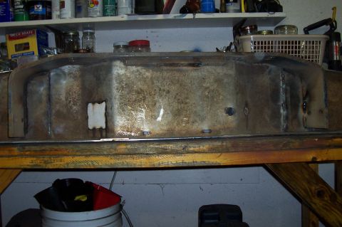 1994 Ford F-150 - This is a metal fuel tank, likely for a vehicle, shown in a workshop setting.