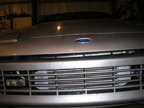 1990 Ford Probe - Front view of a 1990 Ford Probe, showing the grille and Ford emblem.