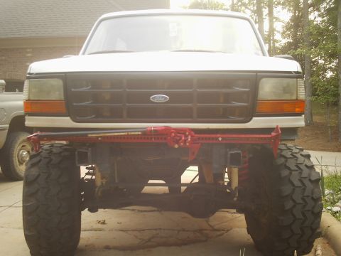 1996 Ford Bronco - This 1996 Ford Bronco features oversized tires and a Hi-Lift jack mounted to the front bumper.