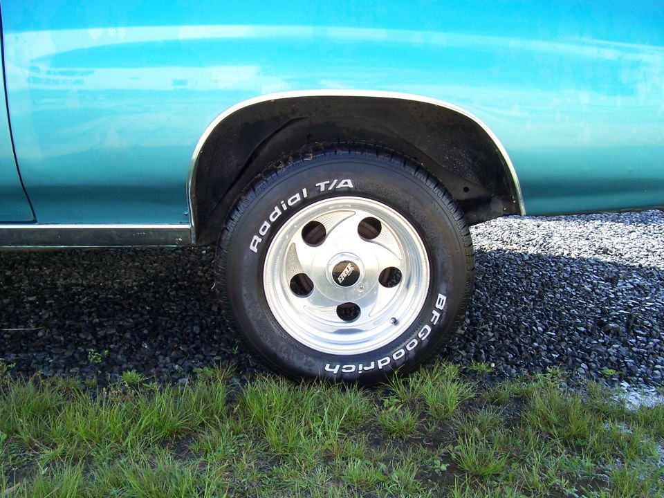 Polished Eagle alloy wheel and BFGoodrich Radial T/A tire on a turquoise car
