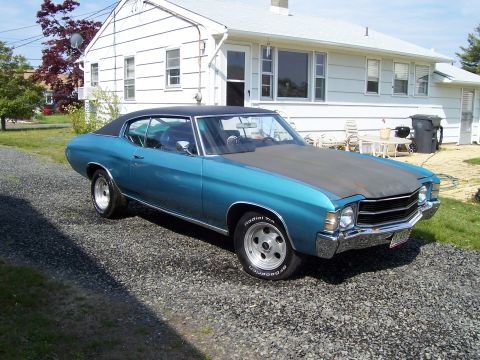 1971 Chevrolet Chevelle - This 1971 Chevrolet Chevelle coupe is seen from the front three-quarter angle on a gravel driveway.