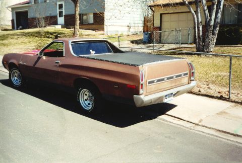 1972 Ford Ranchero - The rear of a brown 1972 Ford Ranchero pickup is shown parked on a residential street.
