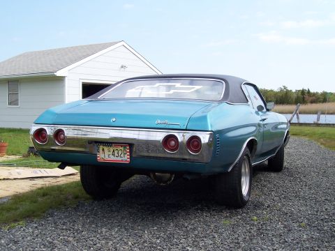 1971 Chevrolet Chevelle - Rear view of a teal 1971 Chevrolet Chevelle with a black vinyl roof and custom license plate.