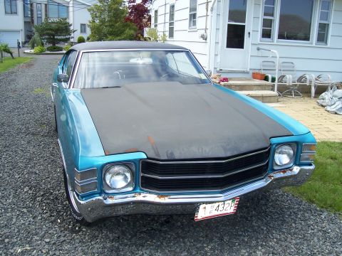 1971 Chevrolet Chevelle - Front view of a blue 1971 Chevrolet Chevelle with a matte black hood.