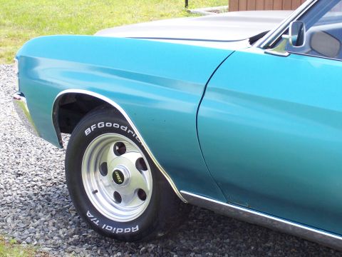 1971 Chevrolet Chevelle - Close-up of a vintage car's side panel and wheel, BFGoodrich tires and chrome accents.