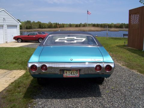 1971 Chevrolet Chevelle - A blue 1971 Chevrolet Chevelle is parked in a driveway with a red Ford Mustang nearby.