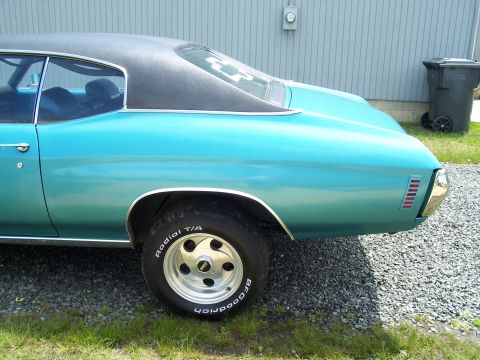 1971 Chevrolet Chevelle - Rear view of a 1971 Chevrolet Chevelle coupe, a teal body and a black vinyl roof.
