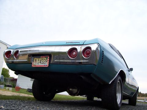 1971 Chevrolet Chevelle - Rear view of a teal 1971 Chevrolet Chevelle, showing its distinctive taillights and chrome bumper.