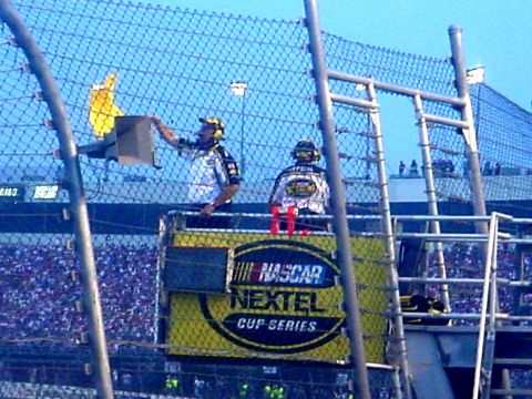 1973 Ford Ranchero - Race officials are positioned in a booth overlooking the track, with a yellow flag displayed.
