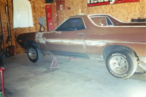 1972 Ford Ranchero - This 1972 Ford Ranchero is on jack stands in a garage, showing signs of body repair and preparation for paint.