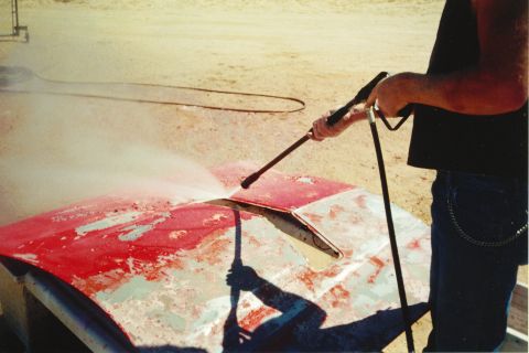1972 Ford Ranchero - Pressure washing a car hood to remove old paint.