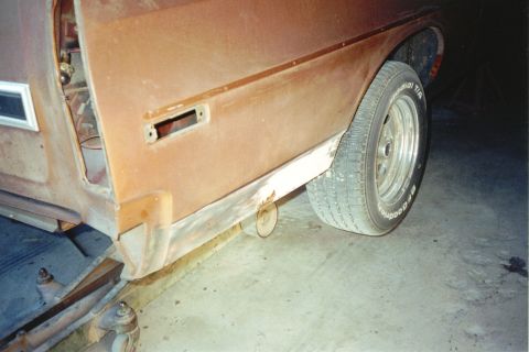 1972 Ford Ranchero - This 1972 Ford Ranchero shows significant rust and body damage, indicating it is in a state of repair or restoration.