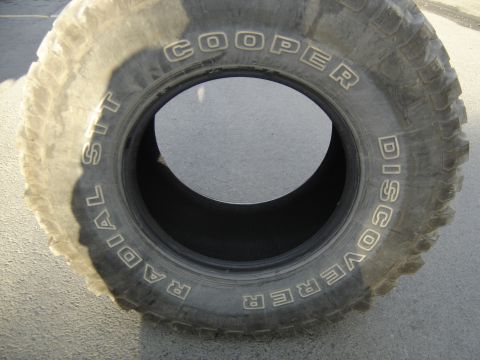 1988 Ford Bronco - Close-up of a Cooper Discoverer Radial tire with white lettering.