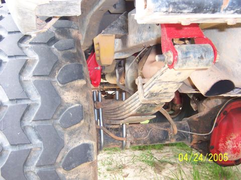 1978 Ford Bronco - Close-up of the rear suspension on a 1978 Ford Bronco, showing a shackle flip kit.