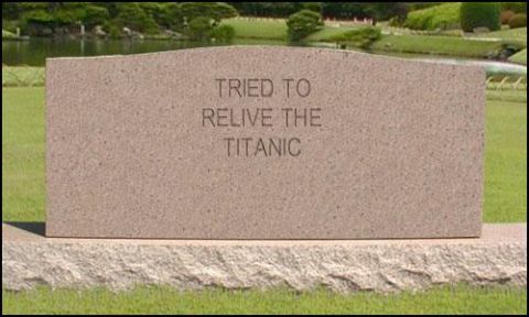 1988 Ford Bronco - A stone monument inscribed with 'TRIED TO RELIVE THE TITANIC' stands in a landscaped park.