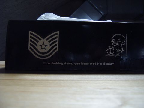 1988 Ford Bronco - A black tissue box features a military rank insignia and a quote, along with a cartoon baby graphic.