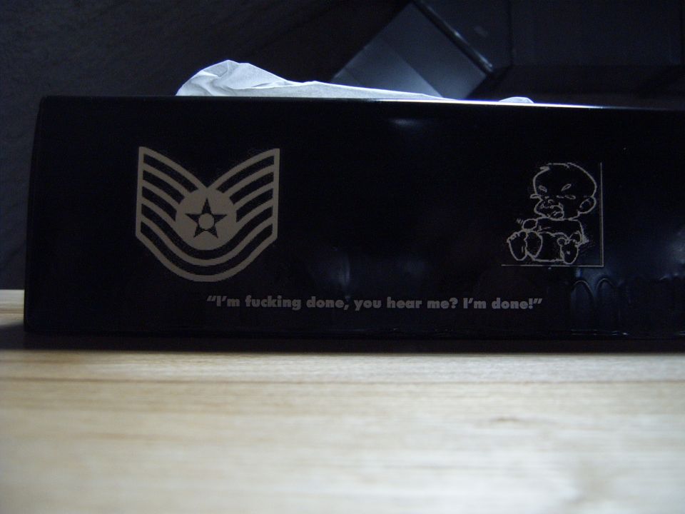 Black tissue box with military rank insignia and "I'm fucking done, you hear me? I'm done!"