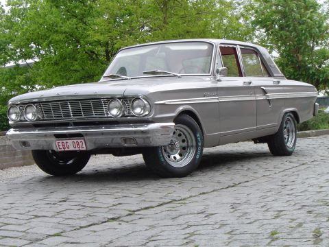 1964 Ford Fairlane - This 1964 Ford Fairlane sedan features a distinctive grille and chrome trim, seen here from a 3/4 front perspective.