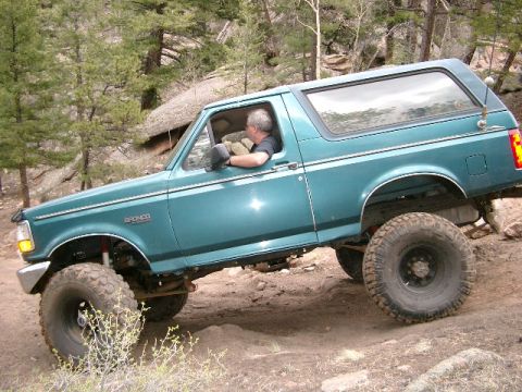 1996 Ford Bronco - Side view going down hill.