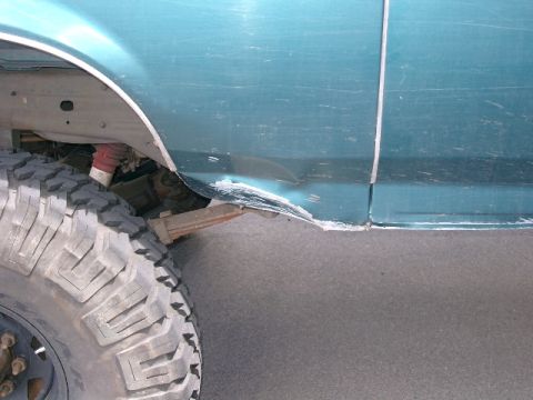 1996 Ford Bronco - While going up this hill I "kissed" that huge rock in the middle. Did very minor sheet metal damage. Just one more scar on the bronco.