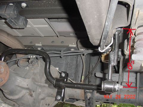 2002 Ford Excursion - Close-up view of a rear sway bar installation on a 2002 Ford Excursion, with a red measurement indicating 8 inches.