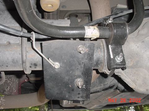2002 Ford Excursion - Close-up of a rear sway bar bracket and linkage, likely from a truck or SUV.