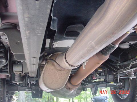 2002 Ford Excursion - The underside of a large truck, showing the exhaust system and drive shaft, with a watermark dated May 26, 2002.