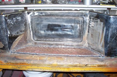 1994 Ford F-150 - Custom fabricated bumper part with visible welding and diamond plate texture.