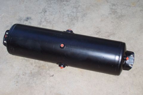 1994 Ford F-150 - This is a black cylindrical air tank with orange fittings, shown on a concrete surface.