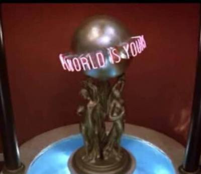 1986 Ford Bronco - A trophy with a neon sign that reads "World is Yours" is displayed.