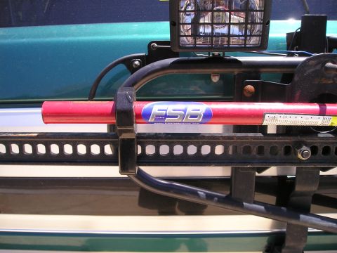 1996 Ford Bronco - This image shows a Hi-Lift jack and a light mounted on the exterior of a vehicle, not a 1996 Ford Bronco.