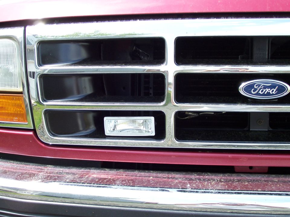 Close-up of a 1995 Ford Bronco grille with the Ford logo visible